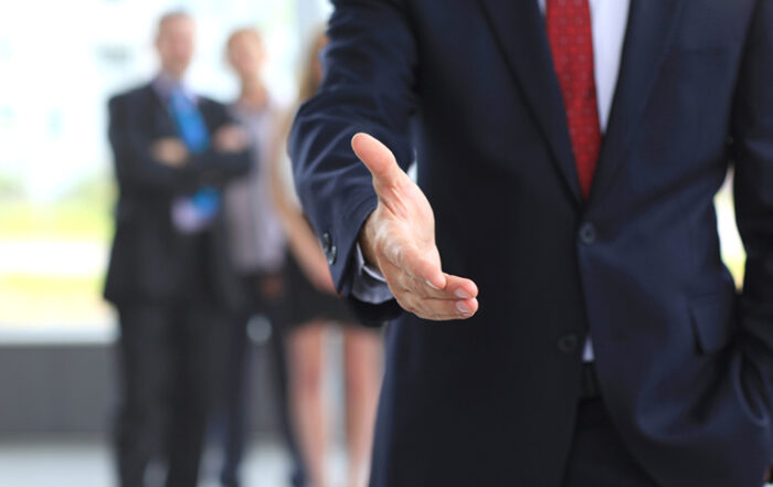 man-in-suit-offering-handshake